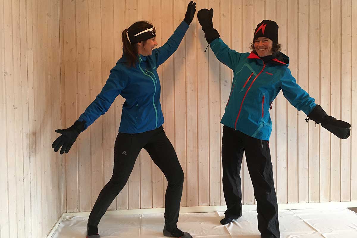 Two skiers dressed in different styles for cross country skiing