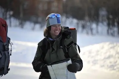 Smiling female ski guide