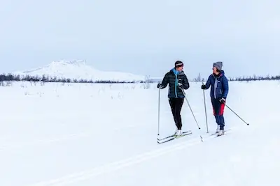 Two female cross country skiers on a cold day