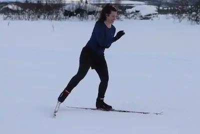 Female skier learning cross country skate technique