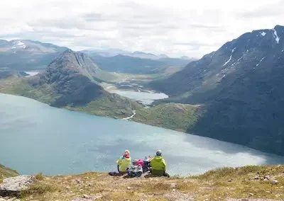 two hikers enjoy the view from Besseggen, Jotunheimen