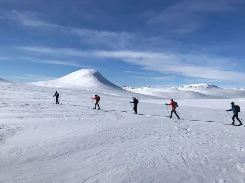 Group of nordic skiers offtrack in the mountains Venabu Fjellhotell