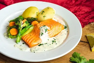 Cooked trout with vegetables. Venabu