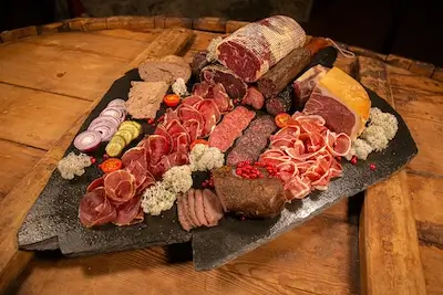 Platter of dried and cured meats. Venabu